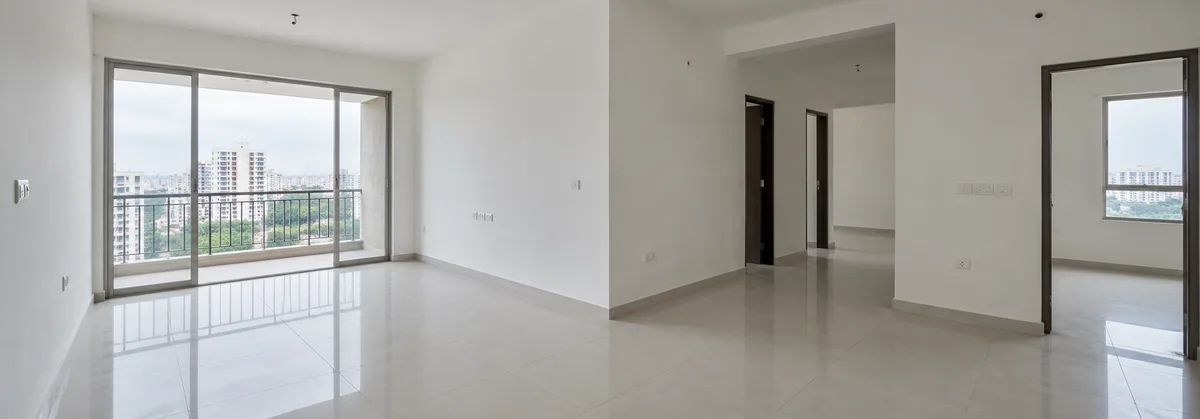 Unfurnished Indian apartment with different-sized rooms and visible electrical points